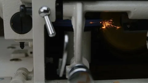 Sparks fly from the inside of the machine for the lower the edge of the skin Video stock 81418842