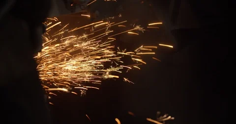 Sparks that fly out when grinding metal of a large grinder. Diamond wheel Stock Footage 124894100