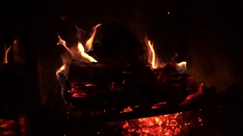 Sparks Fly off of Red Hot Glowing Fire in Slow Motion Stock Footage 149014239