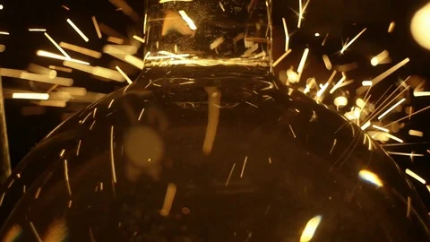 Sparks fly in a spatio-temporal continuum, refracted in glass Stock Footage 95776310