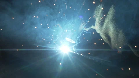 Sparks fly from the welding machine Stock Footage 252382543