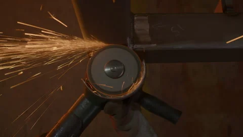 Sparks fly as worker skillfully cuts metal with angle grinder Stock Footage 303110349