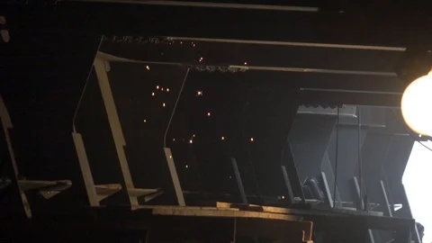 Sparks flying from above from work. Construction 4 Stock Footage 101891349