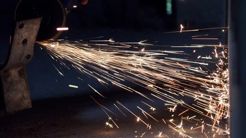 Sparks Flying from Angle Grinder When Cutting and Grinding Metal Slow Motion Video stock 114226094