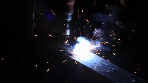 Sparks generated by a Worker Welding Steel in the Dark Stock Footage 95908132