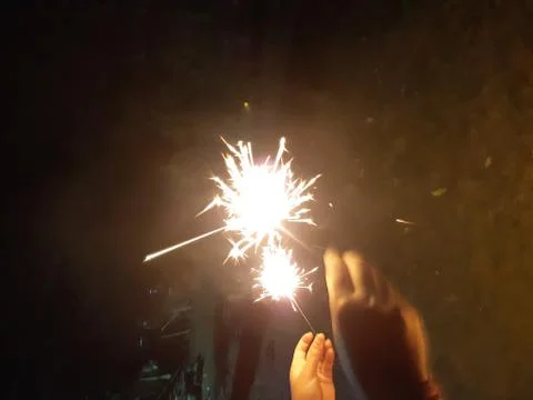 Sparks in hand. Stock Photos