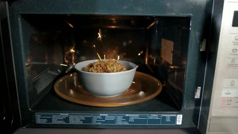 Sparks inside the microwave that broke while making breakfast Stock Footage 151646782