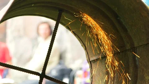 Sparks Inside Rusty Barrel from Metal Cutter Stock Footage 257973086
