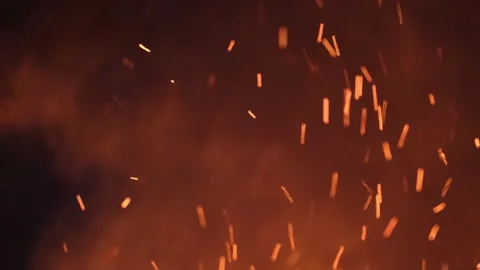 Sparks from a large fire fly up into the sky Stock Footage 157854804