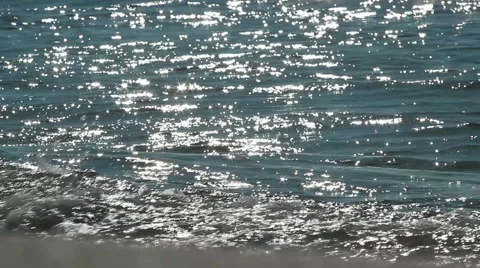 Sparks of light on the sea waves 動画素材 52996610