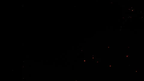 Sparks particles fly in slow motion in the air lingering slowly. Dust Particles Stock Footage 311060756