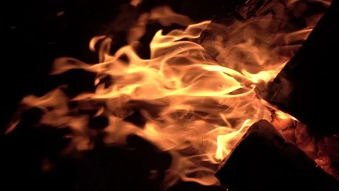 Sparks rising from dancing flames from bright orange fire, VERTICAL Stock Footage 104564166