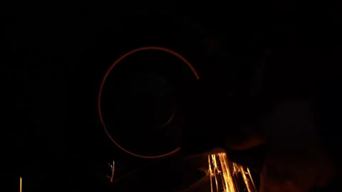 Sparks from sharpening an ax in the dark Stock Footage 231942751