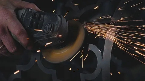 Sparks when cutting and grinding a metal product. Manual angle grinder Stock-Footage 74693102