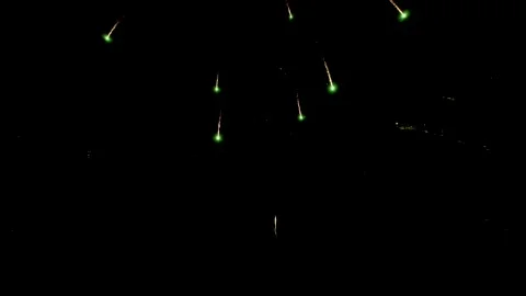 Sparse Firework Sparks Against Black Night Sky, 4K Stock Footage 201128320