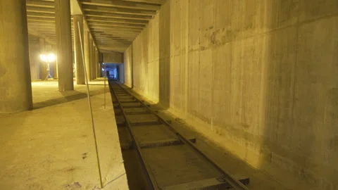 Sparse sleepers rest inside rough trench awaiting assembly Stock Footage 316098259