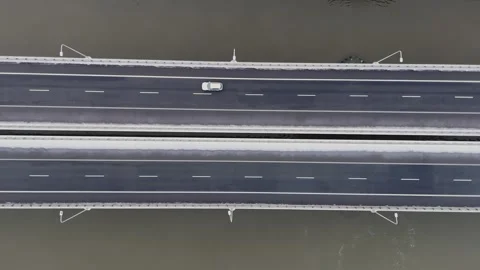 Sparse Traffic on Snowy Bridge, Top View Transport Stock Footage 258142797