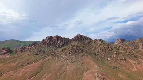 Sparse Vegetation Spreading Across Rocky Hill Slopes In Mongolian Steppe Stock Footage 317310541