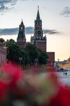 Spasskaya Tower At Moscow Kremlin Overlooking Red Square At Sunset With Clock Stock Photos