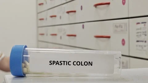 SPASTIC COLON treatment tablets used to relieve bowel spasms and abdominal .. Stock Footage 333762973