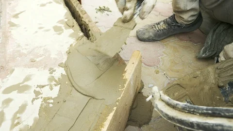Spatula and bucket with mortar on the construction site. Stock Footage 88763869