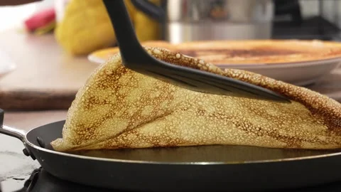 Spatula lifting a pancake, revealing underside texture. Stock Footage 256237027