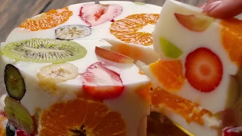 Spatula Lifting a Piece of Fruit Jelly Cake Stock Footage 328093345