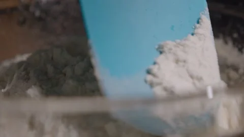 Spatula mixing flour slow motion Stock Footage 149944862