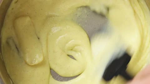 Spatula moves thick mixture around saucepan, close up. Stock Footage 345273651