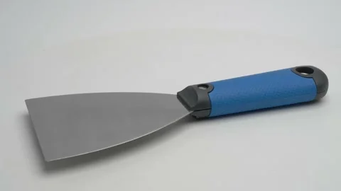 Spatula for repairs on a white background. Stock Footage 265865499