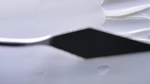 A spatula spreads a smooth Stock Footage 301310034
