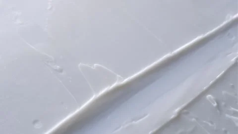 A spatula spreads a smooth Stock Footage 301310035