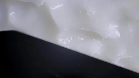 A spatula spreads a smooth Stock Footage 301310051