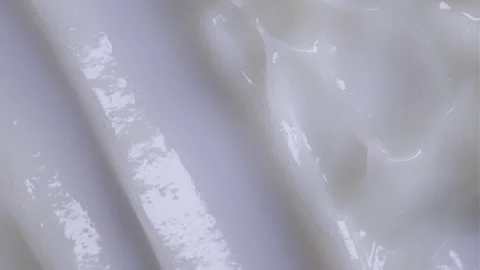 A spatula spreads a smooth Stock Footage 301310054