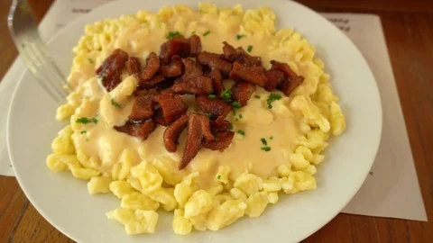 Spatzle with cheese and beef jerky, traditional Swiss dish prepared in Pozuzo 스톡 동영상 125116729