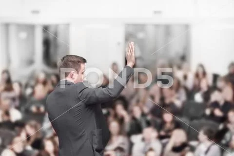 Speaker at a business conference with a public report Stock Photos