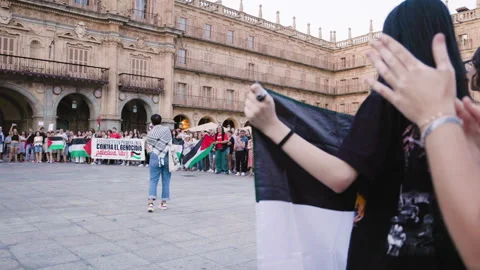 Speaker with megaphone leads protest against Israel’s genocide in Gaza Video stock 317343469