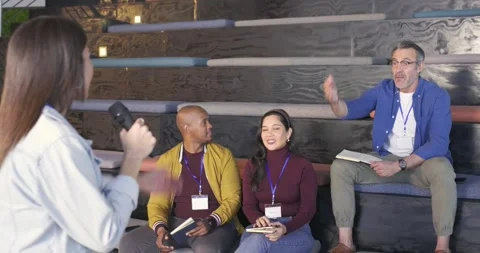 On speaker pausing, diverse attendees raising hands asking questions, clapping Stock Footage 335268856