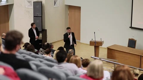 Speaker performs for audience during conference Stock Footage 299678972