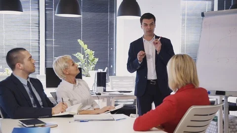 Speaker showing information about research new startup project Stock Footage 119413129