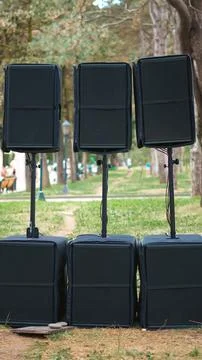 Speaker system setup consisting of three pairs of stacked black audio speaker Stock Photos