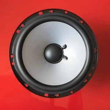 Speaker unit on red background Stock Photos