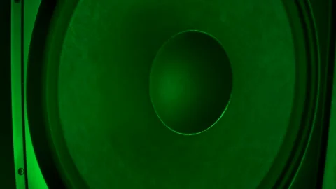 Speakers playing, membranes vibrating lit by colorful neon club lights Stock Footage 145628366