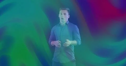 Speaking man gesturing in studio wearing button-up shirt rolled sleeves dark Stock Photos