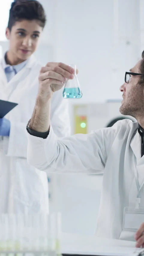 Speaking, science and people with beaker in lab, chemical compound experiment Vídeo Stock 331585354