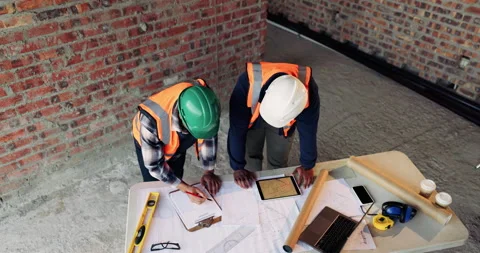 Speaking, team or architect with document at construction site, property Stock Footage 336262789
