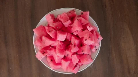 Spearing slice of watermelon on fork 库存影片 346101577