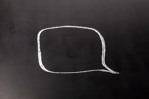 Spech bubble on the chalk board Stock Photos