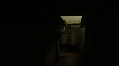 Special agent in camouflage goes through the building with a weapon. Fully Stock Footage 107326261