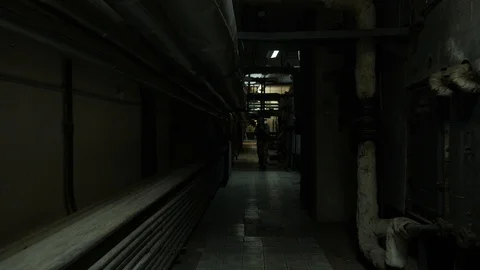 Special agent in camouflage goes through the building with a weapon. Fully Stock Footage 107326314